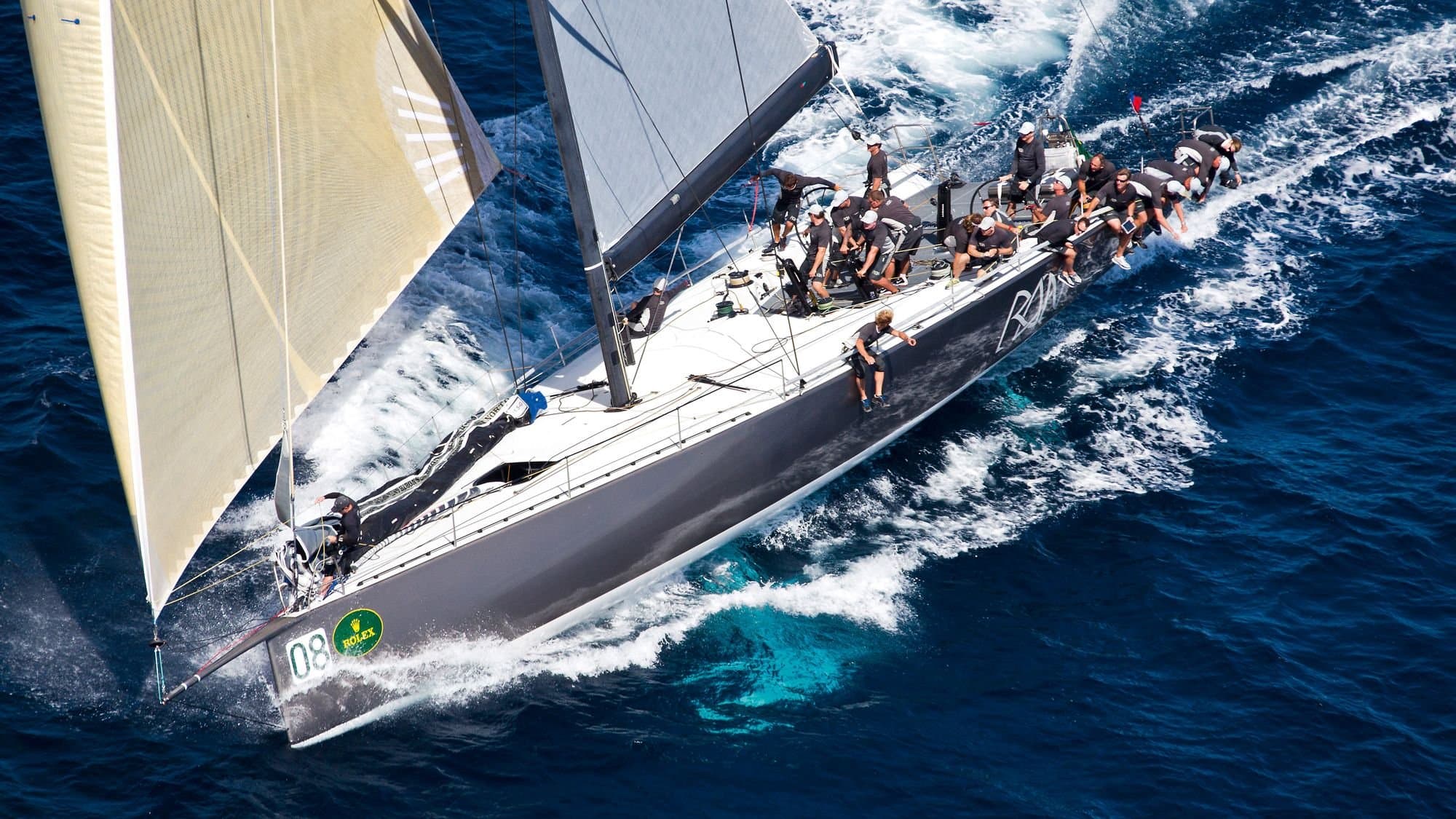 Maxi yacht Ran racing under full sail